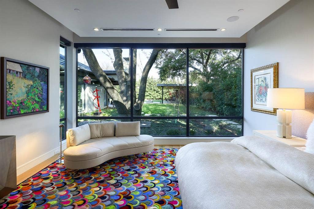 4745 Crooked Lane, Dallas, TX 75229 Primary bedroom with sitting area overlooking landscaped backyard