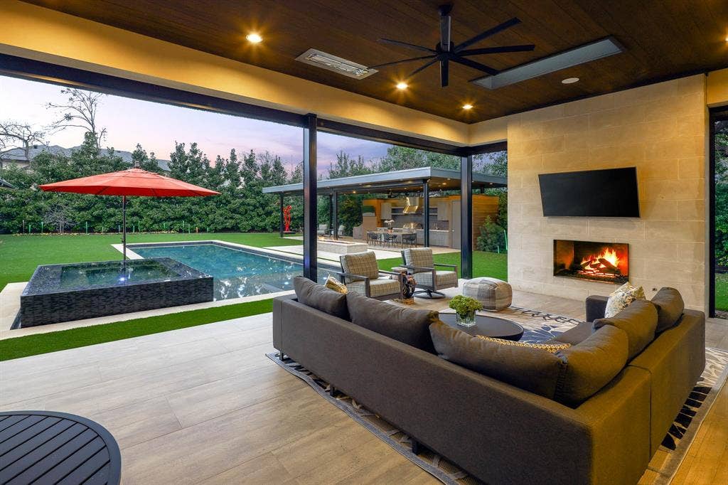 4745 Crooked Lane, Dallas, TX 75229 Outdoor covered loggia with sitting area, gas fireplace, built-in heaters and Phantom screens