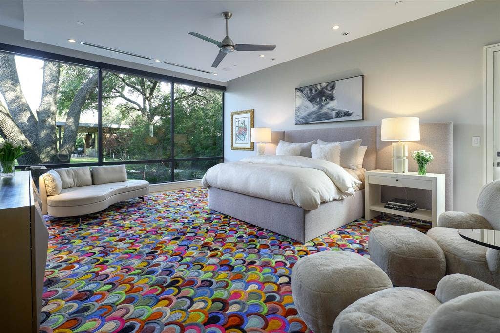 4745 Crooked Lane, Dallas, TX 75229 Primary bedroom with sitting area overlooking landscaped backyard and private door to dog run