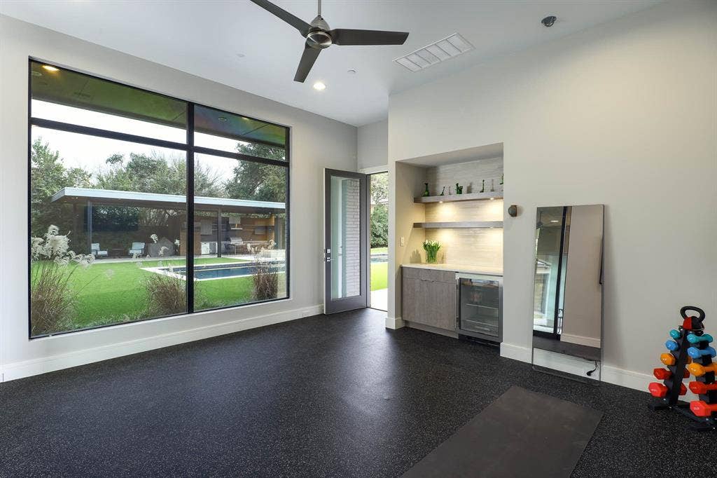 4745 Crooked Lane, Dallas, TX 75229 Separate gym with mirrored walls and padded floors overlooking backyard