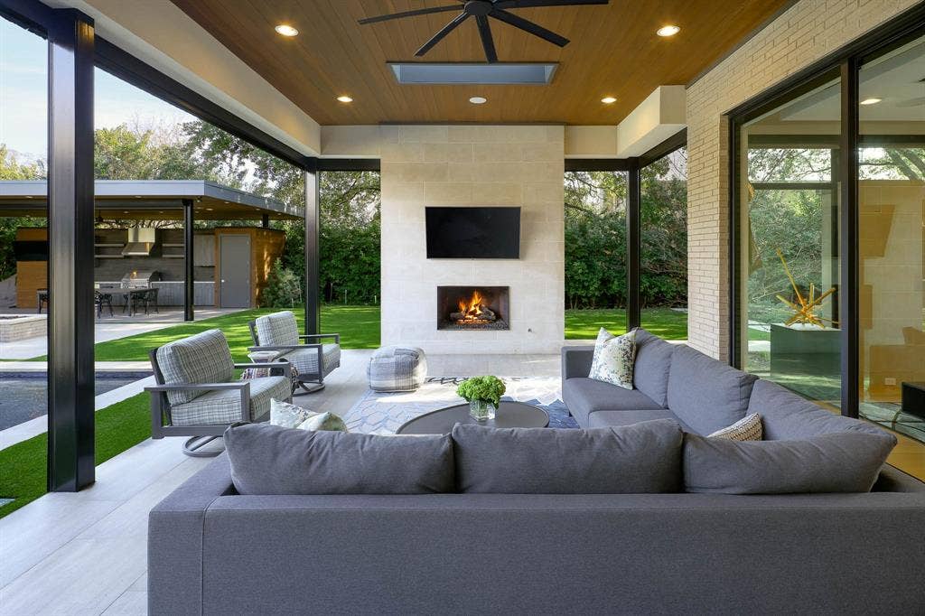 4745 Crooked Lane, Dallas, TX 75229 Outdoor covered loggia with sitting area, gas fireplace, built-in heaters and Phantom screens