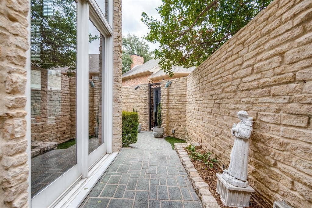 Stone exterior walls with integrated planting beds