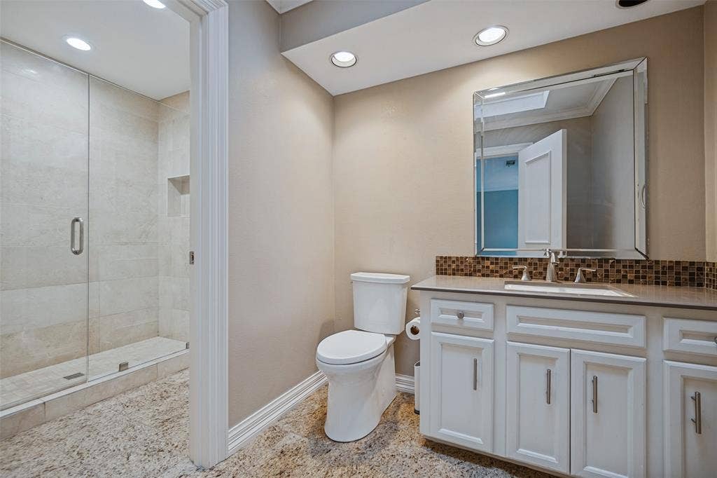 Walk-in shower with clear glass enclosure