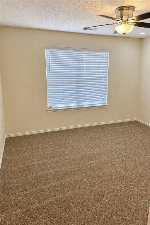 Carpeted room with a ceiling fan, recessed lighting, and window blinds