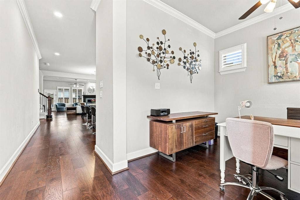 5441 Caine Road, Richardson, TX 75082 Hardwood-style flooring extends throughout, complemented by crown molding and recessed lighting