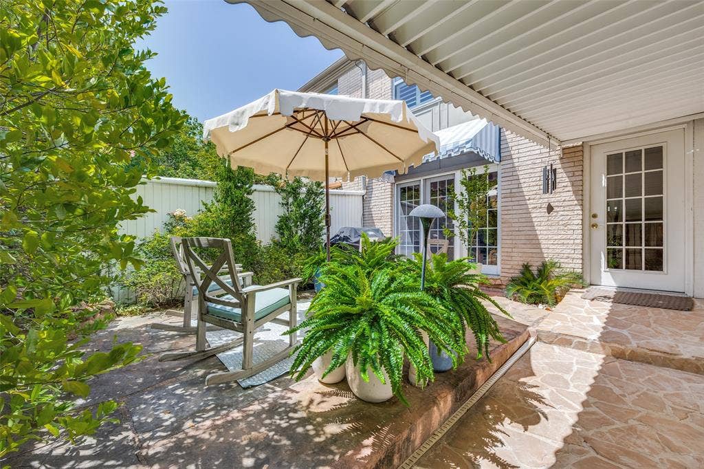 7526 W Northwest Highway, #5, Dallas, TX 75225 Private patio with covered walkway from carport to the property.