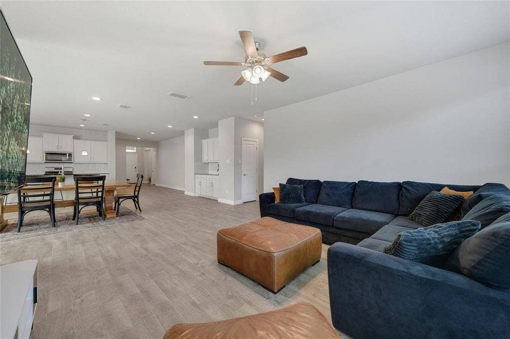 821 Shepperton Way, Fort Worth, TX 76247 Living room with light wood-type flooring and ceiling fan