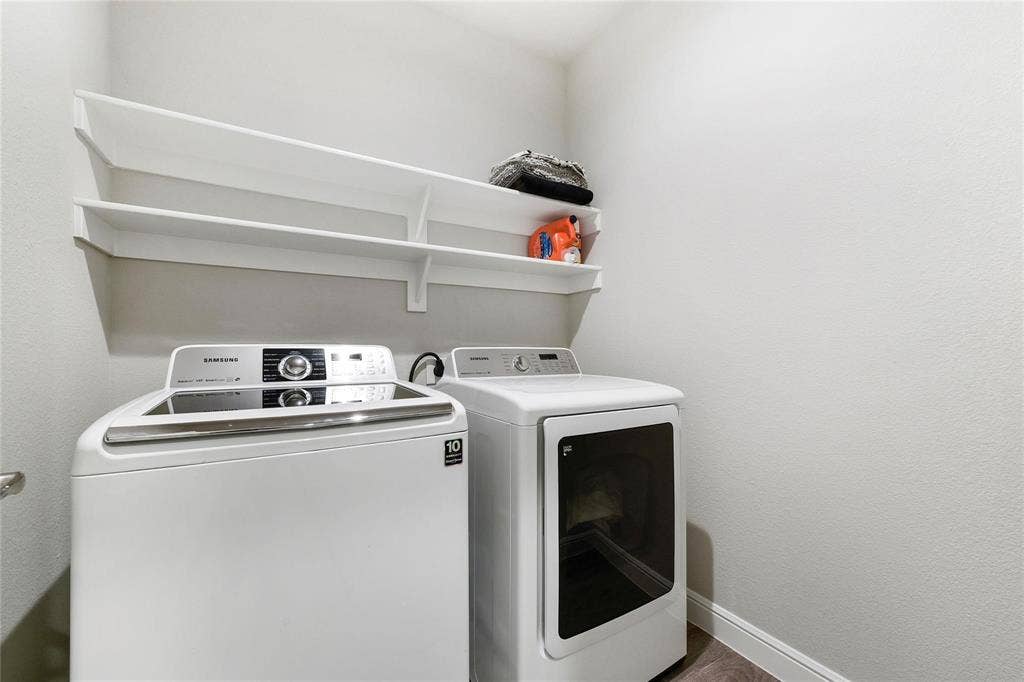 821 Shepperton Way, Fort Worth, TX 76247 Laundry room featuring independent washer and dryer and wood-type flooring