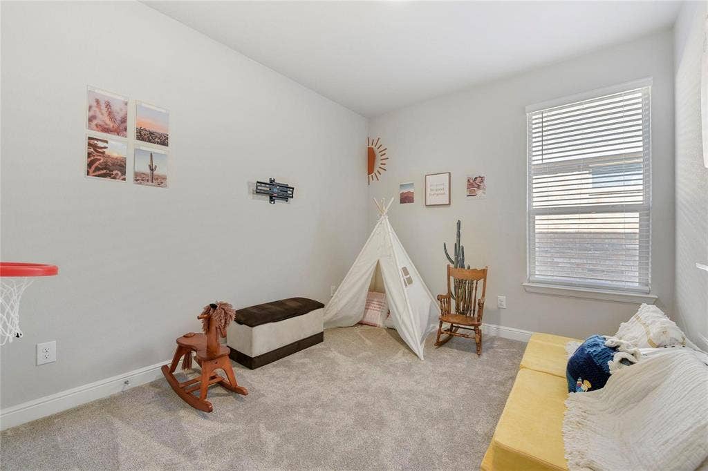 821 Shepperton Way, Fort Worth, TX 76247 Rec room with light carpet