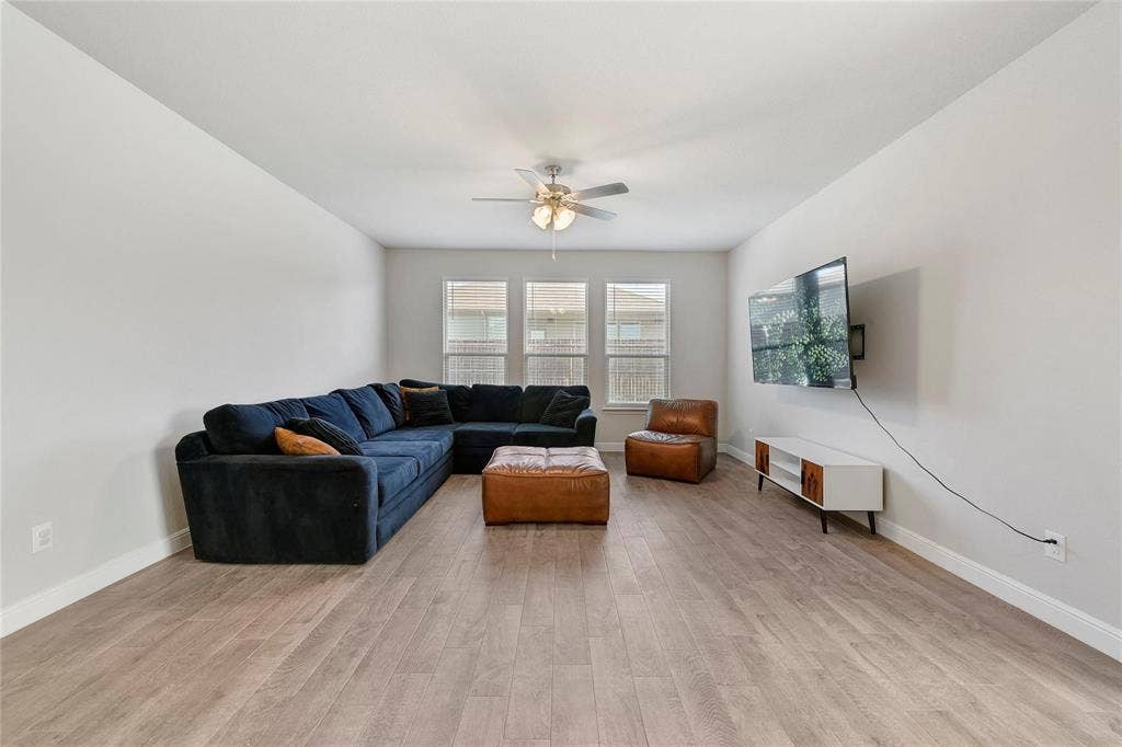 821 Shepperton Way, Fort Worth, TX 76247 Living room featuring light hardwood / wood-style flooring and ceiling fan