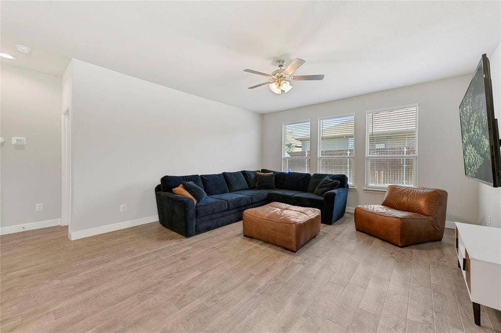 821 Shepperton Way, Fort Worth, TX 76247 Living room with ceiling fan and light hardwood / wood-style flooring