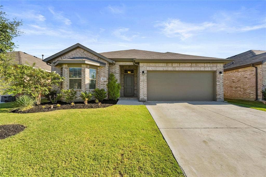 821 Shepperton Way, Fort Worth, TX 76247 View of front of house with a garage and a front yard