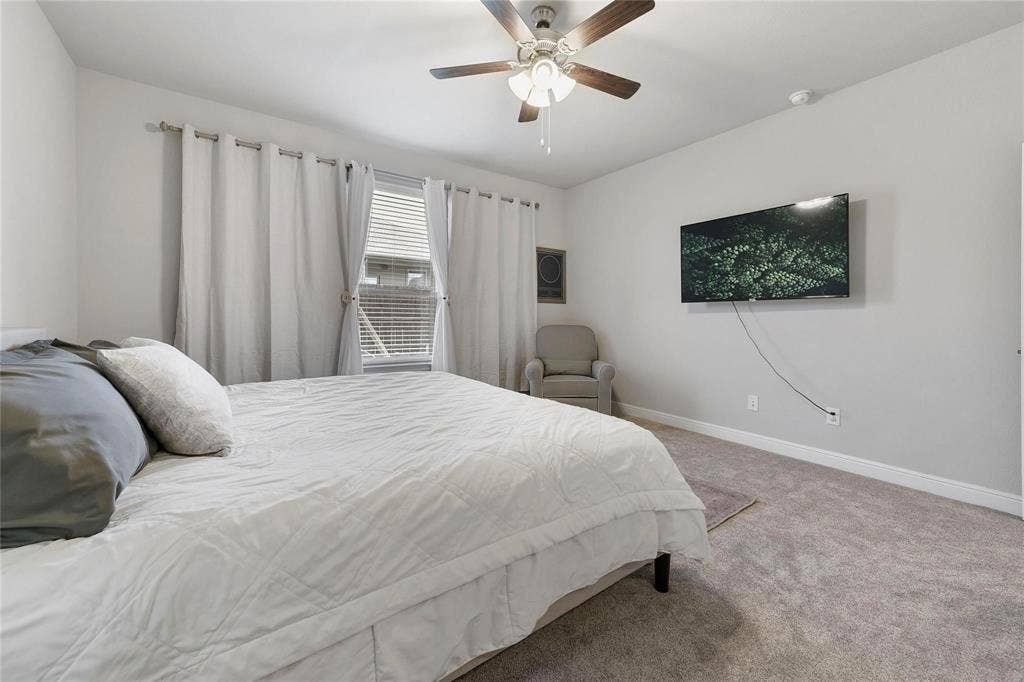 821 Shepperton Way, Fort Worth, TX 76247 Carpeted bedroom featuring ceiling fan