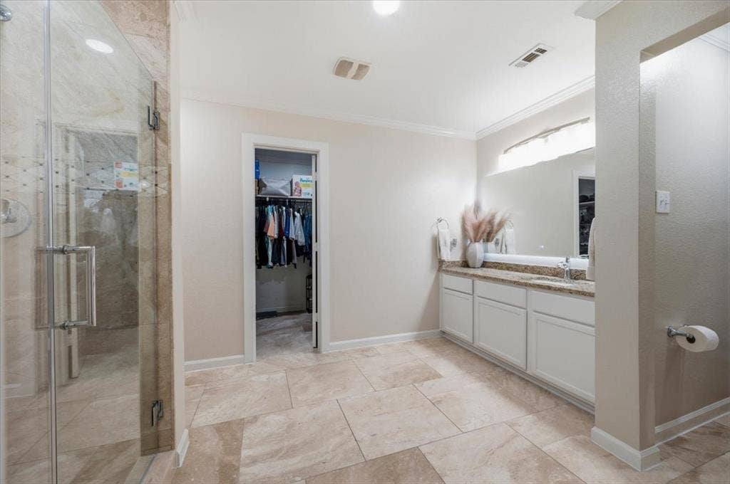 2225 Torch Lake Drive, Forney, TX 75126 Tiled flooring, glass-enclosed shower, built-in vanity with countertop, large mirror, and recessed lighting