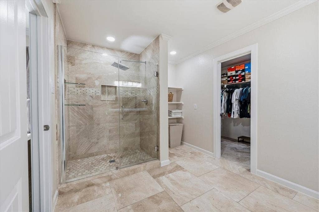 2225 Torch Lake Drive, Forney, TX 75126 Walk-in shower with glass enclosure, tile surround, and rainfall showerhead