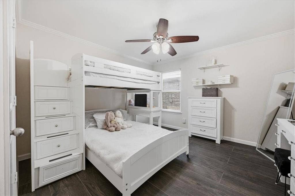 2225 Torch Lake Drive, Forney, TX 75126 Dark wood-finish flooring, crown molding, ceiling fan with integrated lighting, and a window with horizontal blinds
