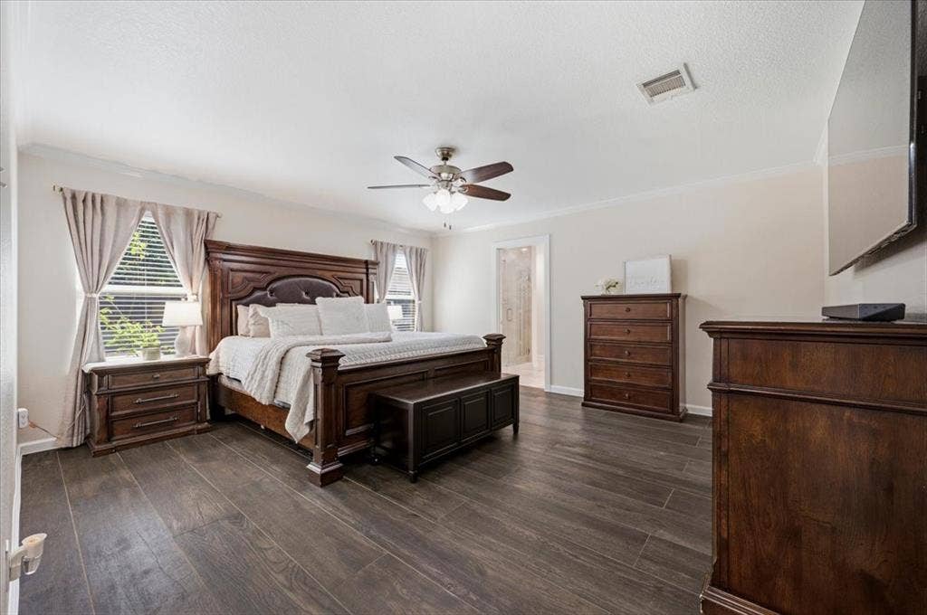 2225 Torch Lake Drive, Forney, TX 75126 Spacious room featuring wood-finish flooring, a ceiling fan, crown molding, and multiple windows