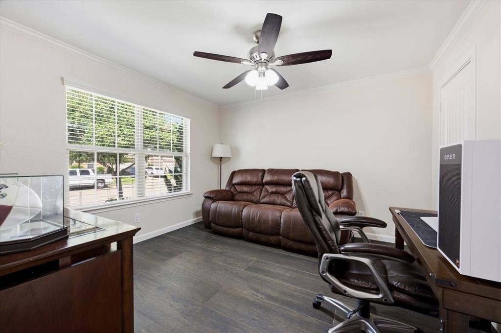 2225 Torch Lake Drive, Forney, TX 75126 Wood-finish flooring throughout, complemented by crown molding and a multi-pane window