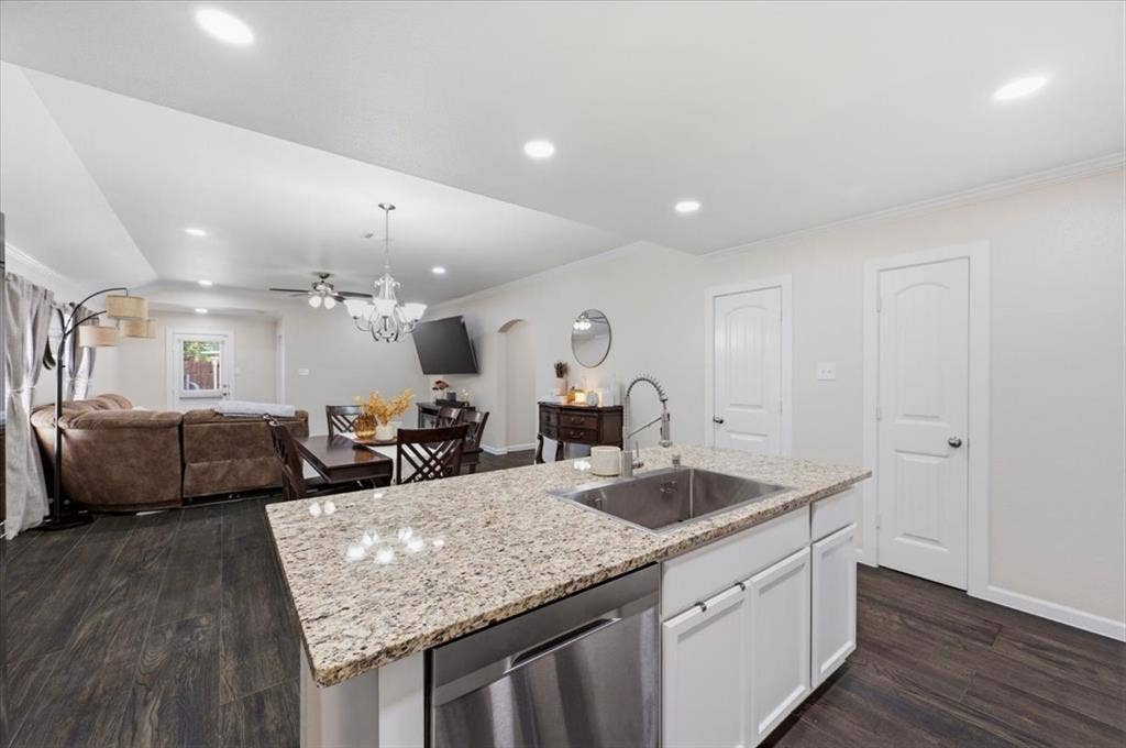 2225 Torch Lake Drive, Forney, TX 75126 Kitchen island with granite countertop and stainless steel sink