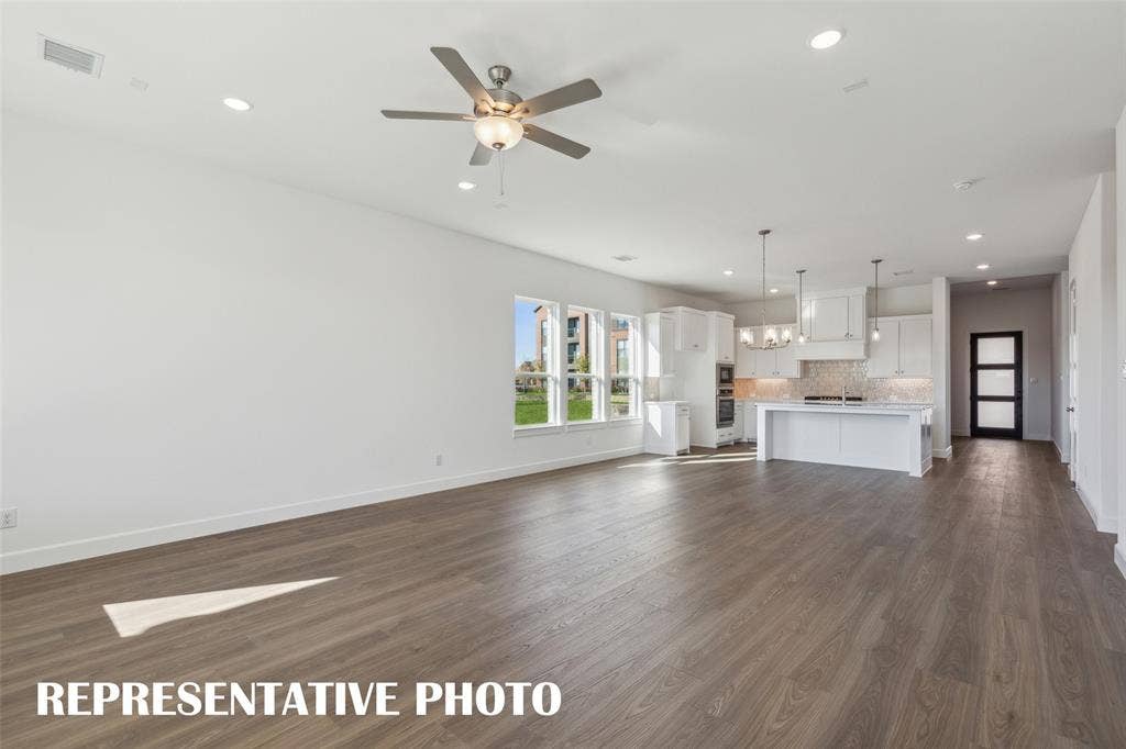 1805 Vetiver Glow Drive, Celina, TX 75009 You'll love hosting family celebrations in this delightful family room! REPRESENTATIVE PHOTO