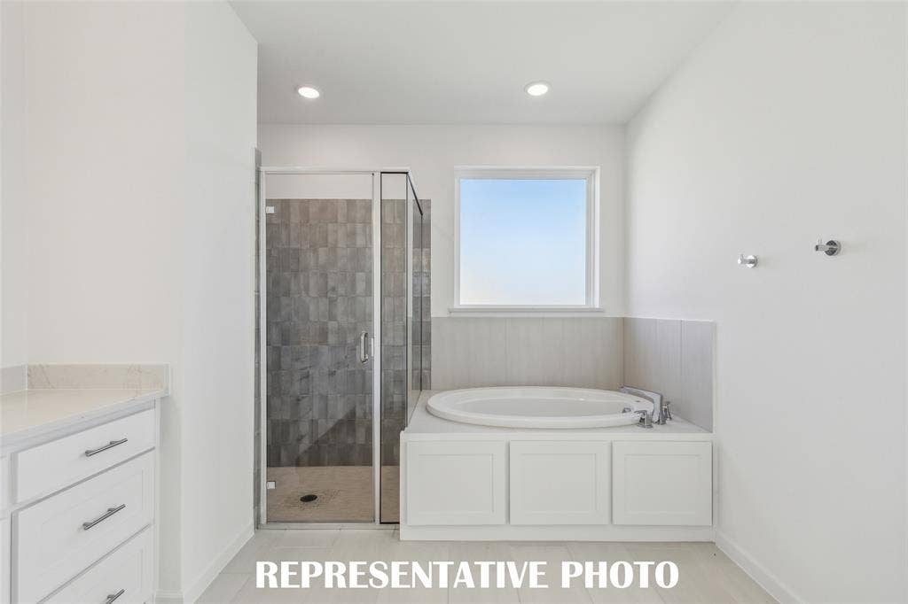 1805 Vetiver Glow Drive, Celina, TX 75009 Whether it's soaking your cares away or indulging in a long, luxurious shower, this owner's bath has it all! REPRESENTATIVE PHOTO