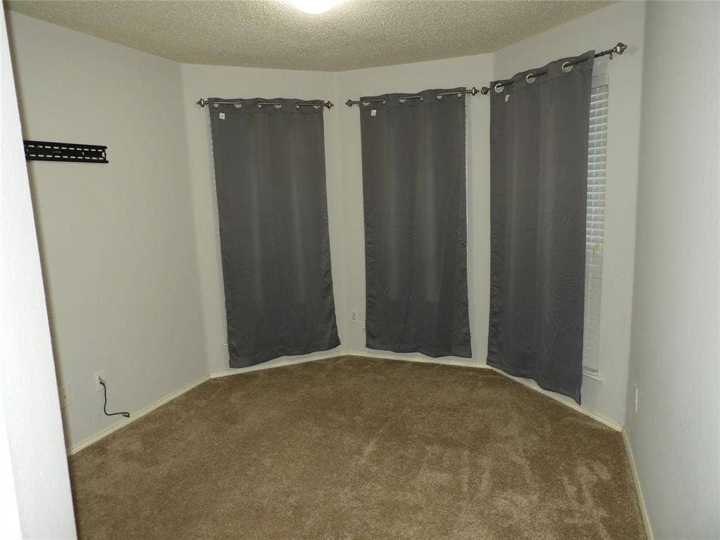 Bedroom #2 with bay windows.