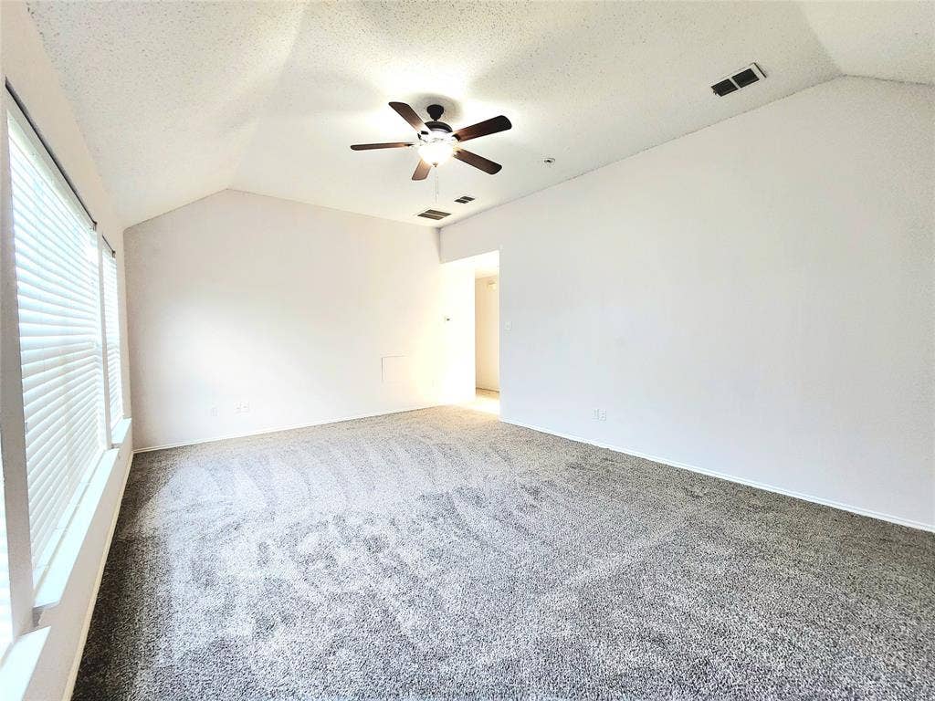 3625 Mason Drive, Plano, TX 75025 Vaulted ceiling with a ceiling fan, grey carpet flooring, and white window blinds