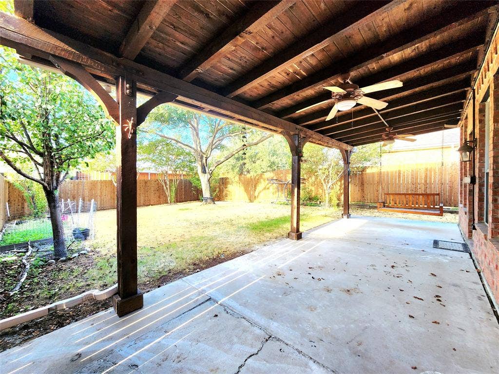 3625 Mason Drive, Plano, TX 75025 Expansive covered patio with a wood-finish ceiling, exposed beams, and multiple ceiling fans