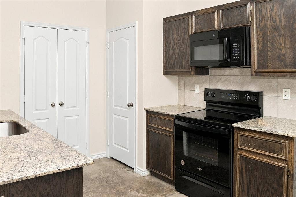 6015 Amelia Earhart Boulevard, #B, Killeen, TX 76543 Wood-finish cabinetry paired with light-toned countertops