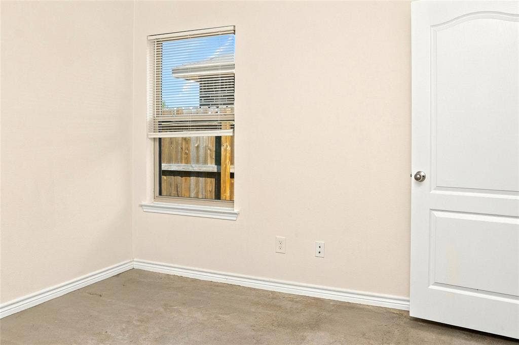 6015 Amelia Earhart Boulevard, #B, Killeen, TX 76543 White painted walls, a single window with blinds, and a white interior door