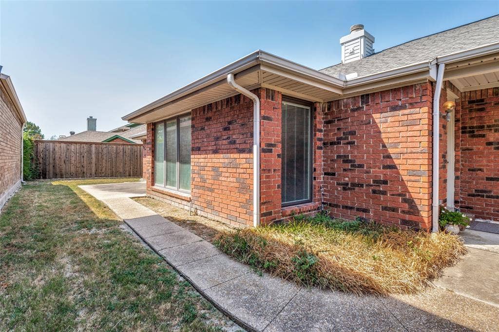 Red brick exterior with white trim