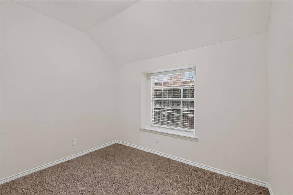 8108 Case Drive, Plano, TX 75025 Neutral painted walls, carpeted flooring, and a single window with blinds