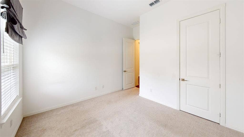 3285 Dover Drive, McKinney, TX 75069 Carpeted flooring, white walls, white trim, recessed window, and white interior doors