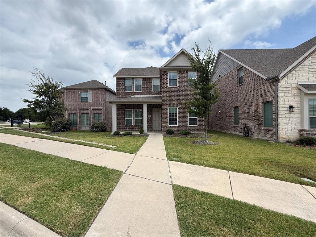 3285 Dover Drive, McKinney, TX 75069 Brick exterior with a covered entry, multiple windows, and a concrete walkway