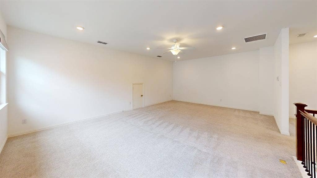 3285 Dover Drive, McKinney, TX 75069 Expansive carpeted area with recessed lighting, a ceiling fan, and a built-in storage door