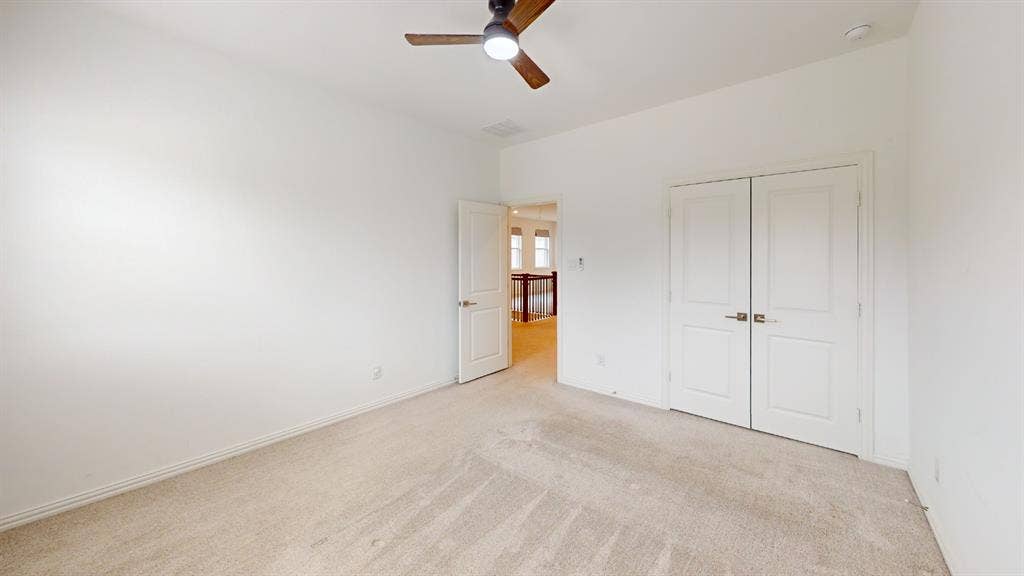3285 Dover Drive, McKinney, TX 75069 Neutral tone wall color, light-toned carpet, recessed ceiling lighting, ceiling fan, and double panel doors