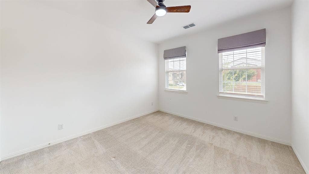 3285 Dover Drive, McKinney, TX 75069 Wall-to-wall carpeting, two windows with blinds, ceiling fan with light fixture