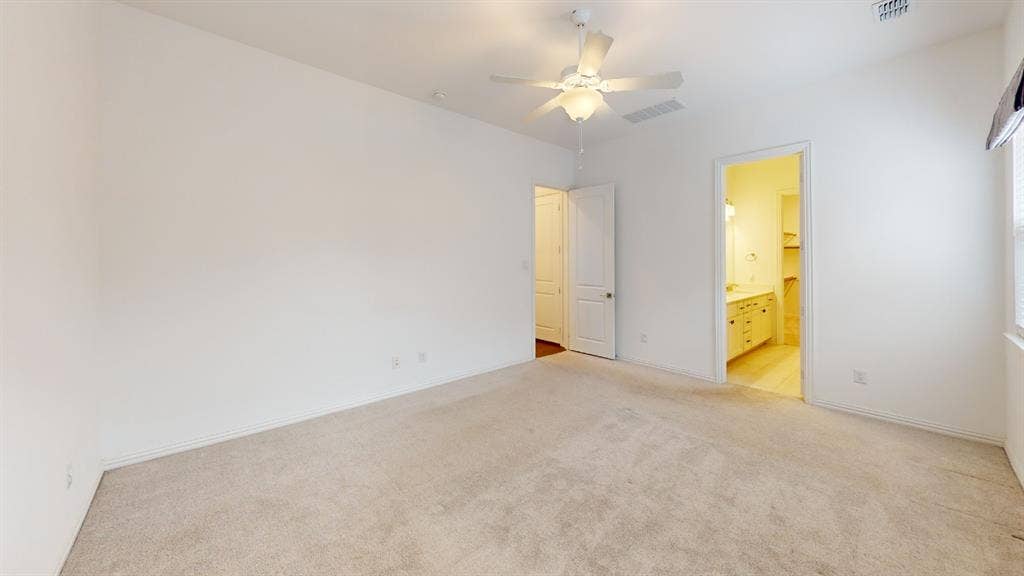 3285 Dover Drive, McKinney, TX 75069 Carpeted flooring, ceiling fan, white paneled doors, and bright interior lighting