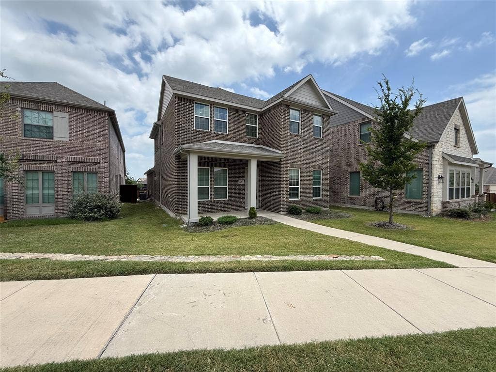 3285 Dover Drive, McKinney, TX 75069 Two-story brick exterior with a covered entry, mature tree, and concrete pathway