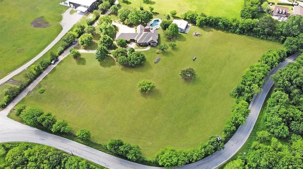 TBD OAK GROVE Road, Burleson, TX 76028 Expansive green space with mature trees, a private residence, and an in-ground pool