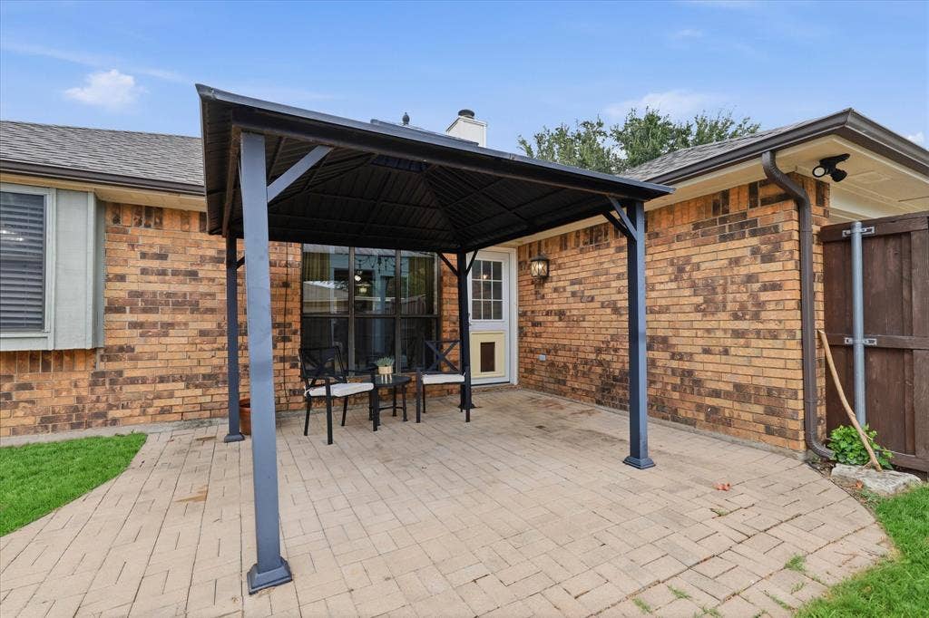Covered patio extends the living space outdoors and offers a comfortable spot for dining, relaxing or entertaining.
