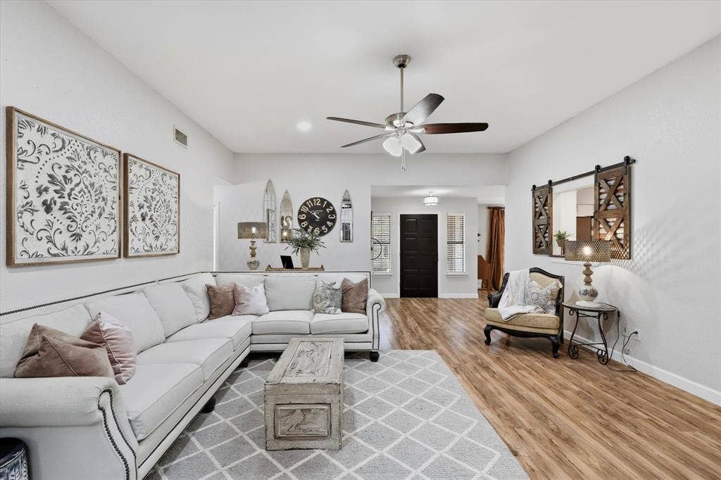 Fresh, neutral interiors and wood-like flooring create a bright, comfortable setting for everyday living and entertaining.