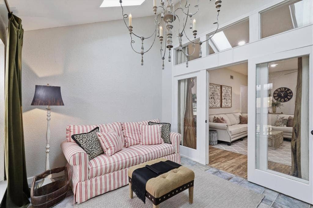 Light-filled flex space connects to the main living area and offers views of the backyard.