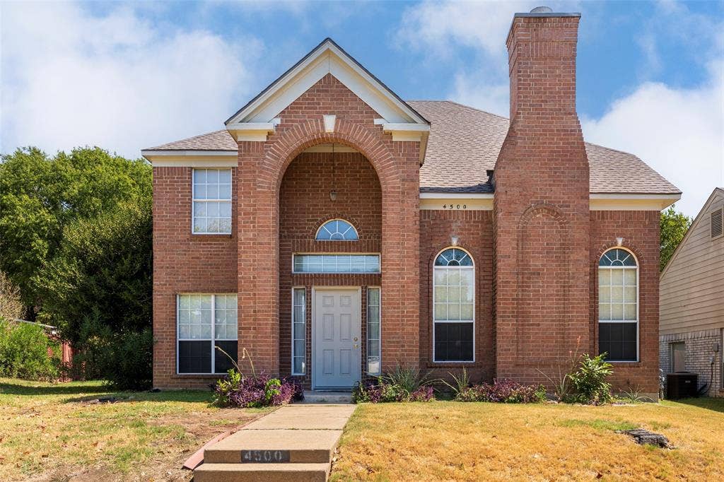 4500 Fargo Drive, Grand Prairie, TX 75052 Brick exterior with arched entryway, brick chimney, gabled roofline, and arched window details