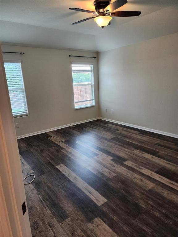 729 Watson Way, Crowley, TX 76036 Unfurnished room with ceiling fan and dark wood-type flooring