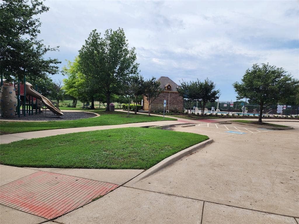 729 Watson Way, Crowley, TX 76036 View of home's community with a playground and a lawn