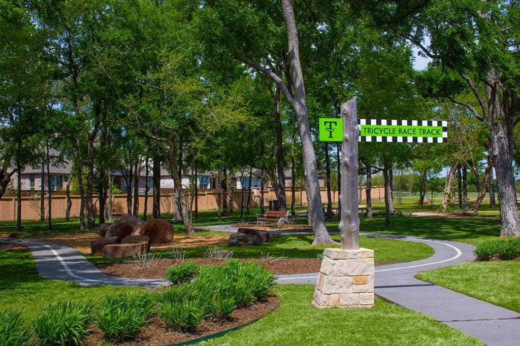 7421 San Jacinto Trail, McKinney, TX 75071 Trinity Falls photo from their website showing one of the many amenities, trails, pools, gym and parks in the community.