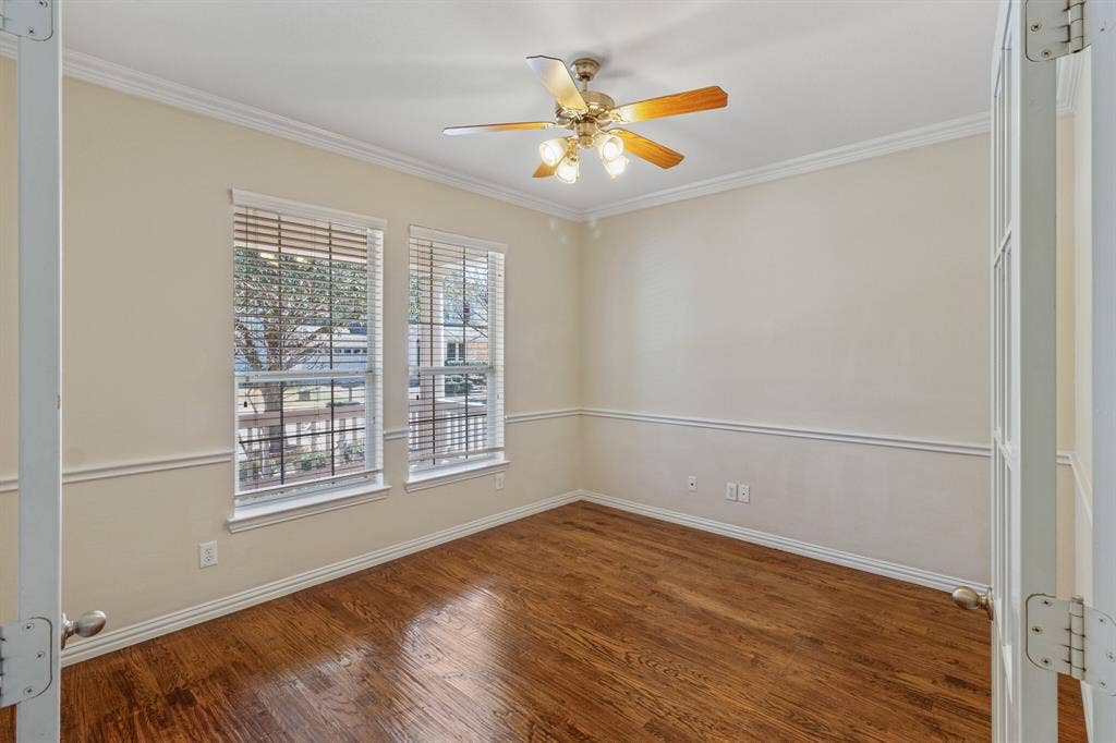 4908 Rushden Road, McKinney, TX 75070 Hardwood flooring, dual windows with blinds, crown molding, chair rail molding, and a ceiling fan with light fixture