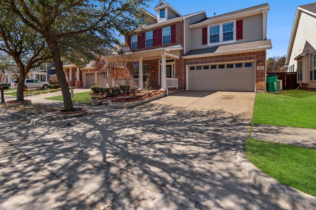 4908 Rushden Road, McKinney, TX 75070 Brick and siding exterior with red window shutters, covered front porch, and an attached two-car garage