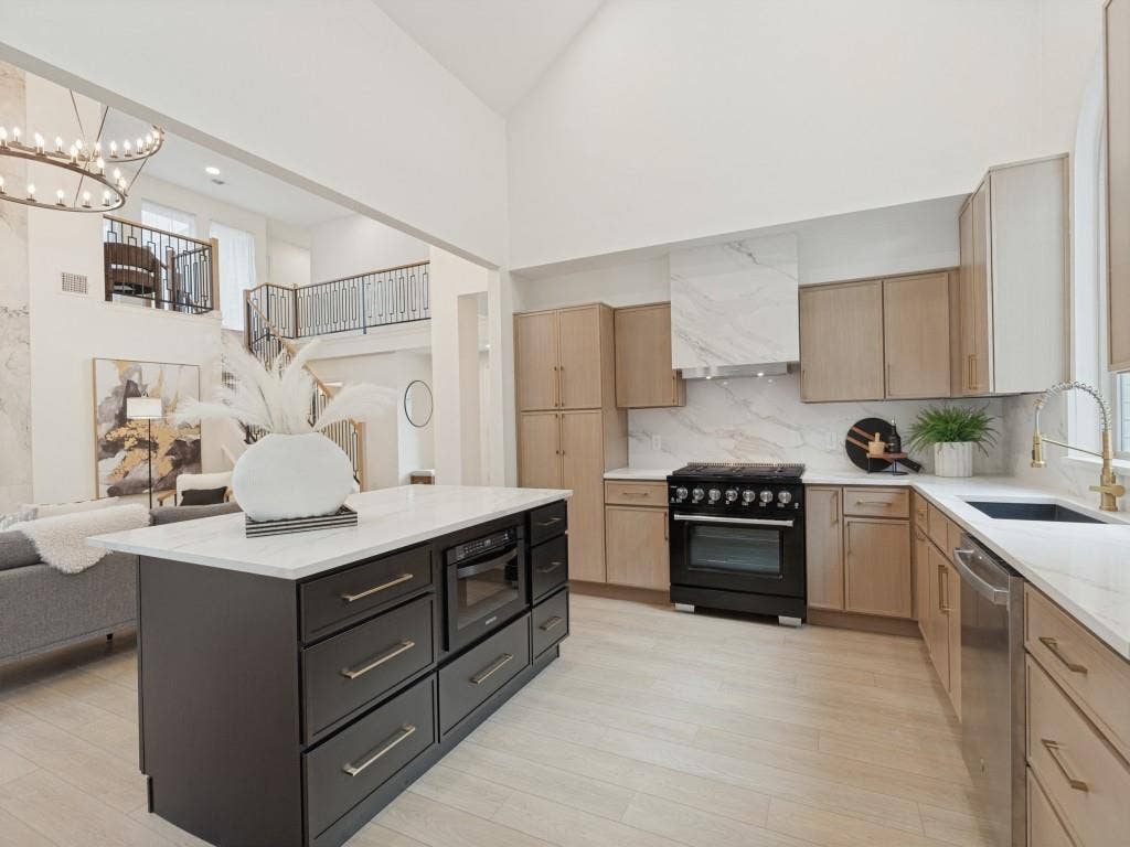 6029 Buffridge Trail, Dallas, TX 75252 Gorgeous, clean, modern kitchen has been redesigned from the ground up. Designer range, all new cabinets, large island with storage and microwave.